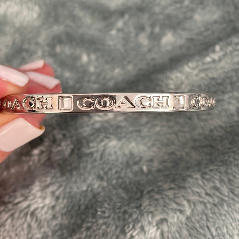 Beautiful Coach silver signature bracelet..  great to stack with other bangles.